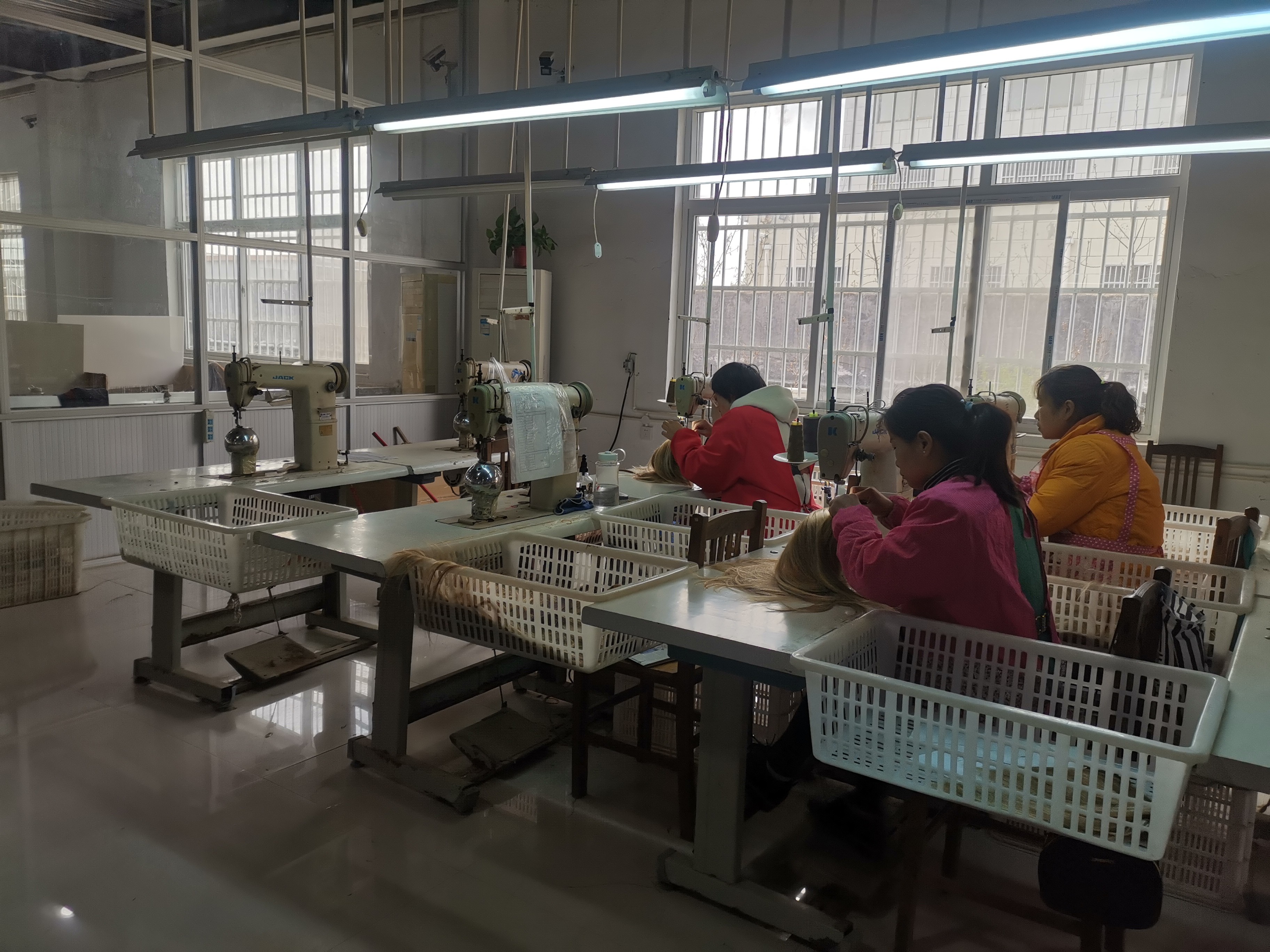 Skilled artisans at sewing stations